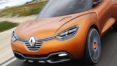 A close up of the front end of an orange car